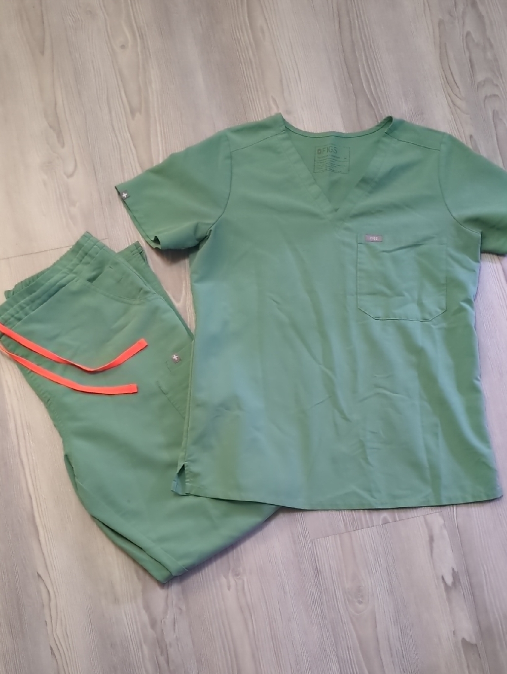 Figs Catarina scrub top and matching high-waisted Yola skinny pants in a sage gr